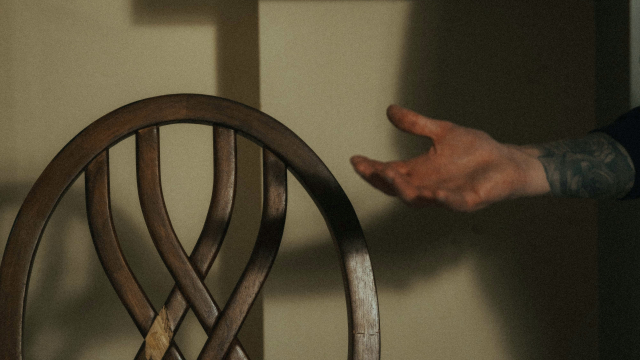 chair_empty_hand_reaching_out_unsplash