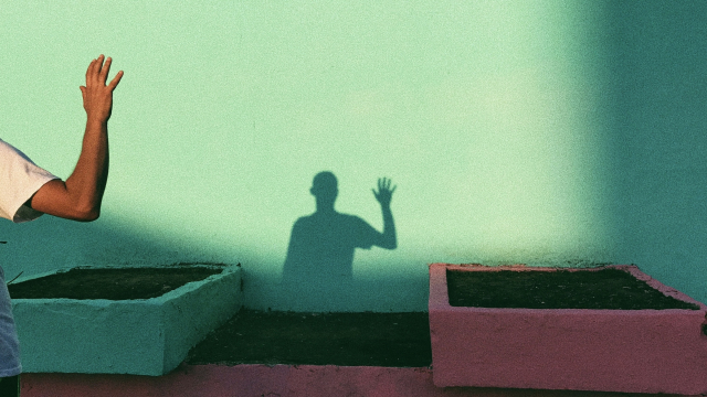 waving_shadow_wall_hand_unsplash