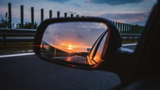 car_mirror_reflection_road_unsplash