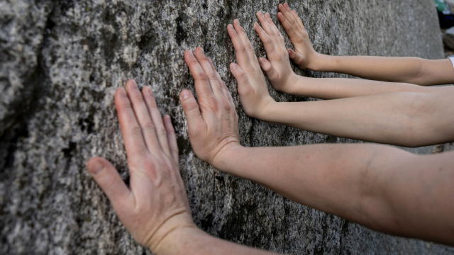 five_hands_cliff_rock_unsplash
