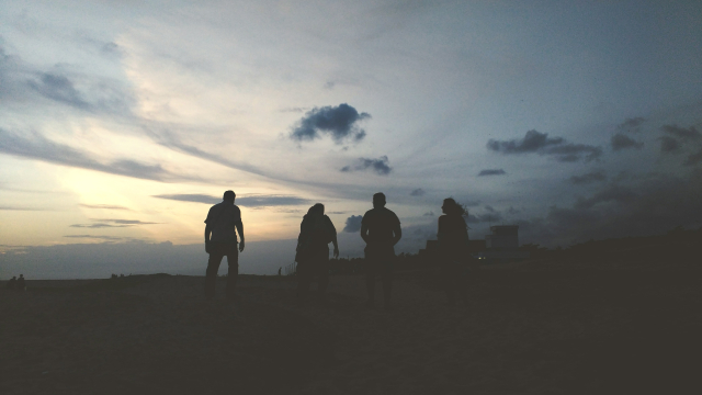 four_silhouettes_walking_clouds_unsplash