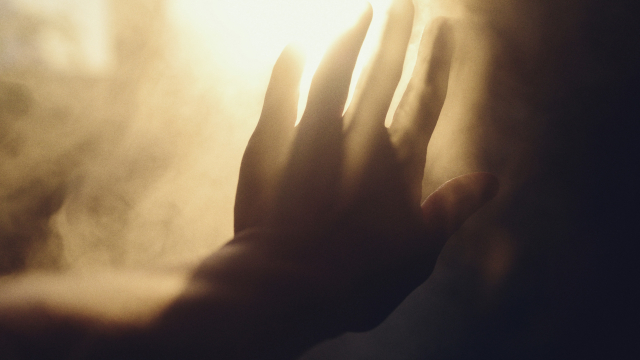 hand_reaching_smoke_light_unsplash